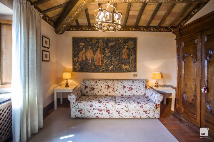 Cozy and tidy interior with simple furniture and historical details. Perfect for relaxation.