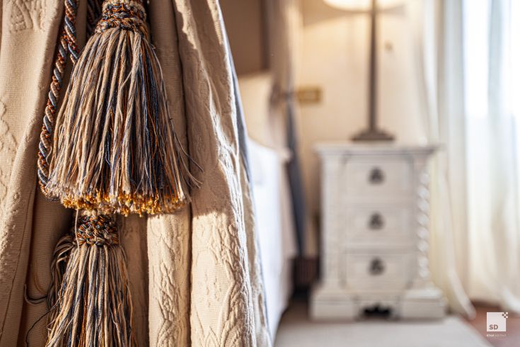 A fringed drape in a cozy setting, creating a relaxing atmosphere.