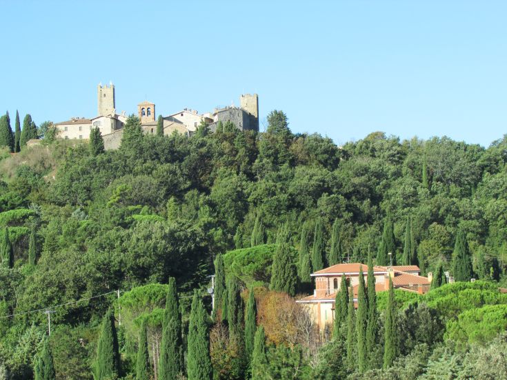 A scenic view of green hills with historic buildings, perfect for a peaceful break in nature.