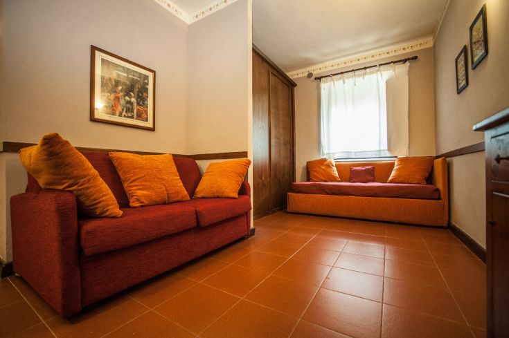 Cozy environment with warm-toned sofas, perfect for relaxation and social moments.