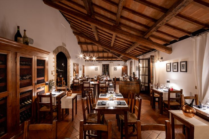 Elegant restaurant with tastefully arranged tables and understated decor typical of high-end dining.