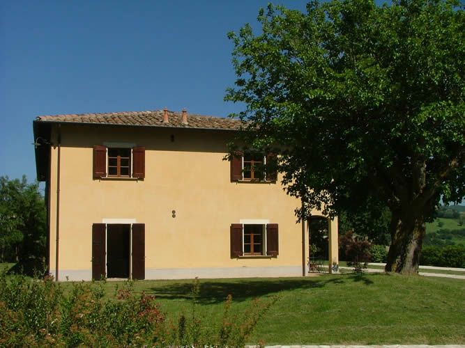 A holiday home located in the Umbrian countryside, surrounded by olive groves and forests.