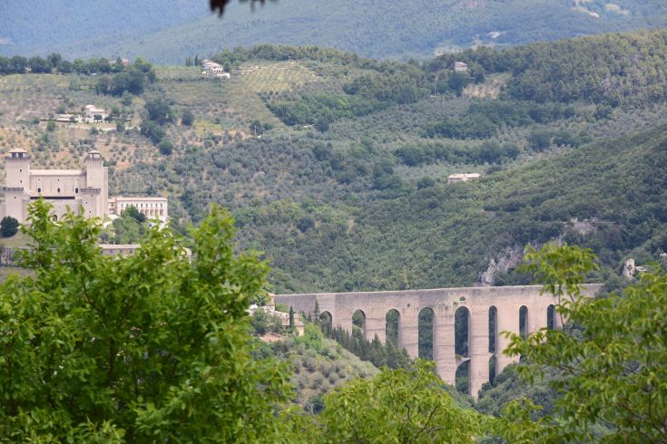 A typical hilly scene of Umbria featuring an ancient aqueduct prominently.