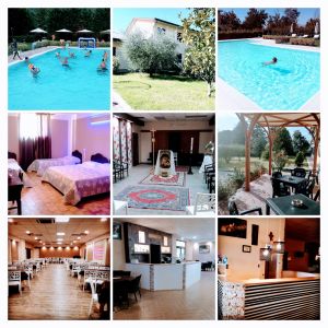 A scenic view of a resort featuring a pool, guest rooms, and communal areas.