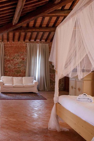 Interior of a farmhouse room, featuring rustic decor and simple details.