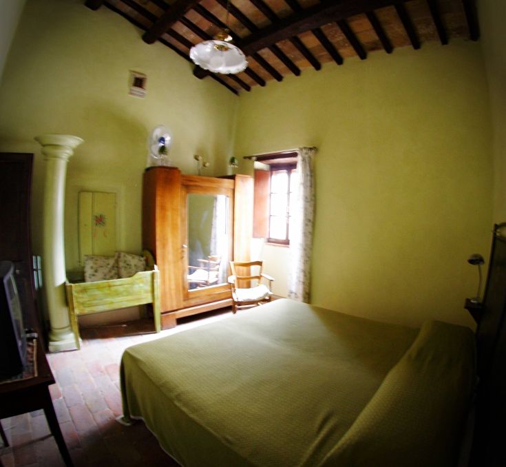 Cozy room with simple furnishings and a peaceful atmosphere.