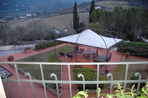 A serene garden with a gazebo, perfect for outdoor relaxation moments.
