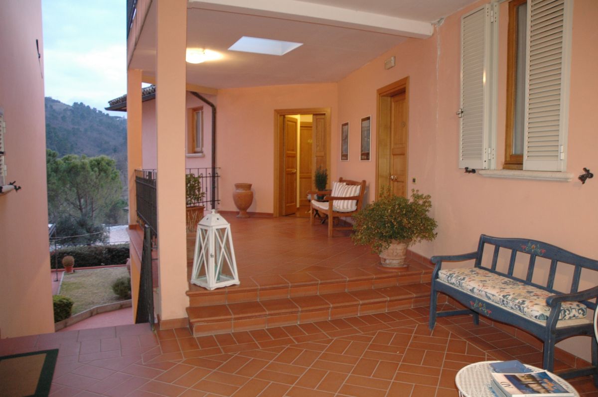 Cozy entrance of Villa Cristina with a countryside view and a relaxing atmosphere.