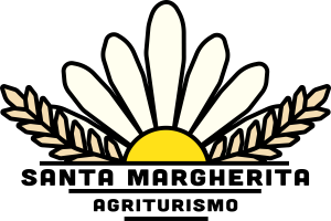 The farmhouse is located in the Umbrian countryside, surrounded by trees and greenery, providing a peaceful atmosphere.