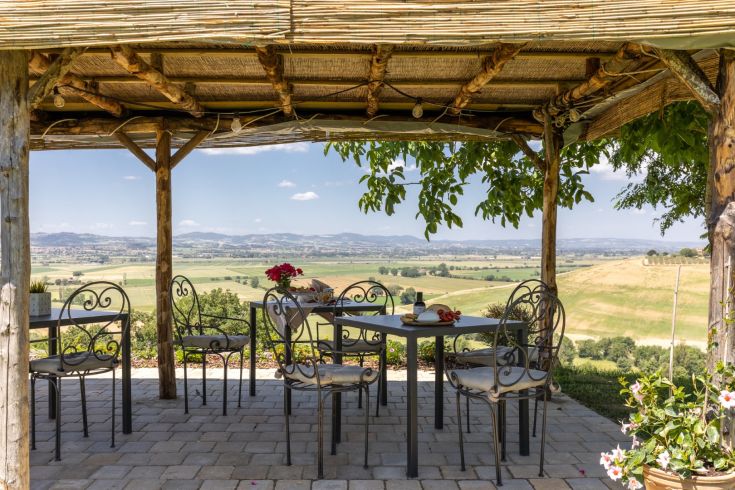 Open-air area in a farmhouse with views of the Umbrian countryside.