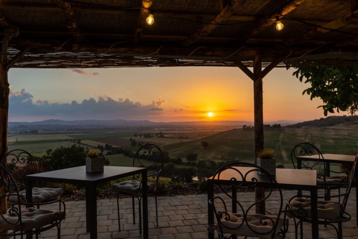 Sunset panorama with warm colors from a farmhouse in the countryside.