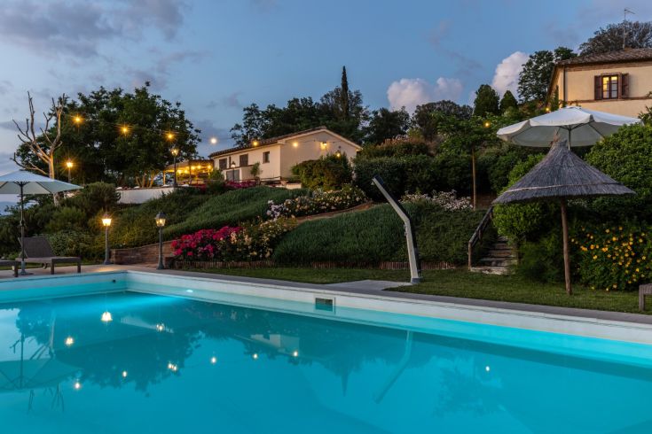 A farmhouse located in the lush Umbrian countryside, perfect for a relaxing and peaceful getaway.