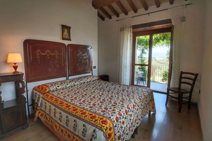 Cozy room with a panoramic view, featuring rustic elements and traditional-style furnishings.