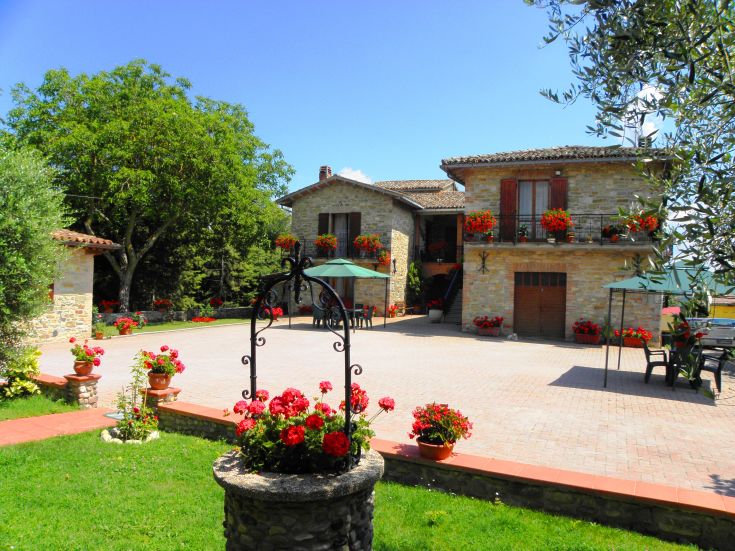 A farmhouse in a lush green setting, surrounded by plants and flowers, perfect for those seeking relaxation in nature.