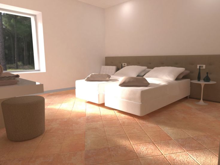 Ein einfaches und gemütliches Zimmer mit Einzelbetten, einem Fenster, das natürliches Licht bietet, und minimalistischer Einrichtung.