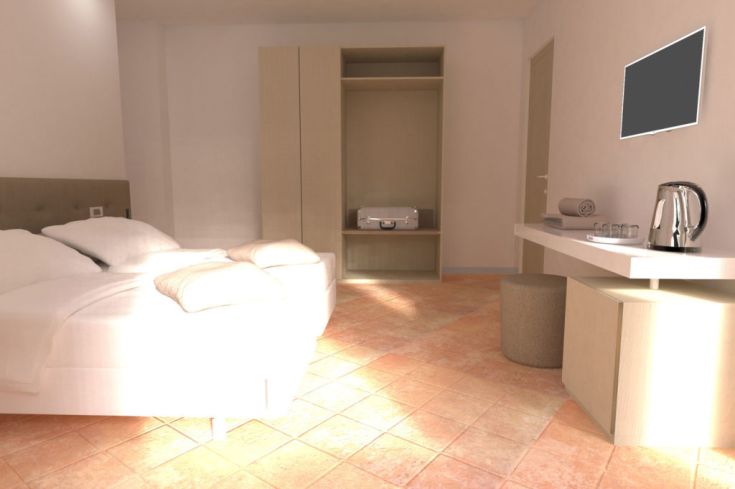 Geräumiges und gut beleuchtetes Zimmer mit einfacher, gemütlicher Einrichtung.