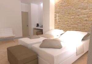 Ein gemütliches Zimmer mit Steinwänden und bequemen Betten, ideal für einen ruhigen Aufenthalt.