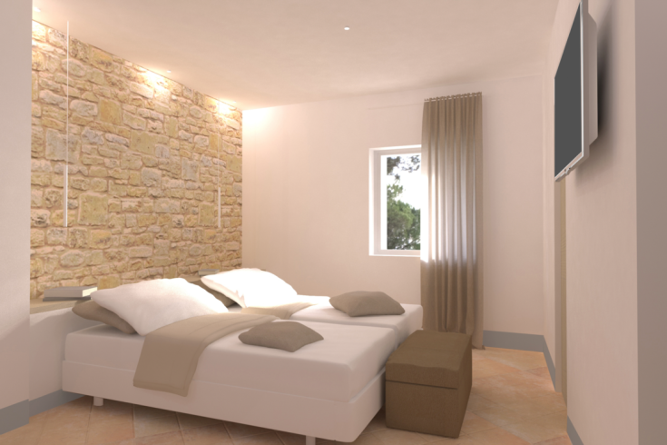 Einfaches Schlafzimmer mit Steinwänden und einem Doppelbett.