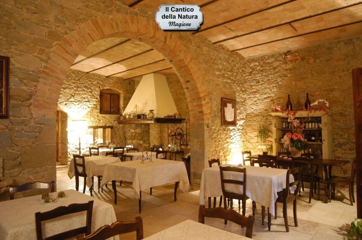 A cozy restaurant with stone and wood elements, perfect for spending quality time together.