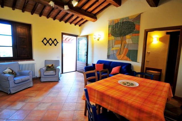 Interior of a building with simple furnishings and rustic details, perfect for family moments.