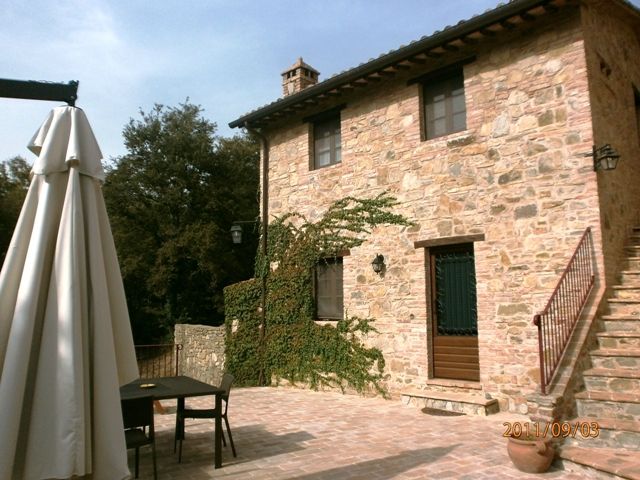 A stone farmhouse with a simple ambiance and outdoor spaces perfect for relaxation.