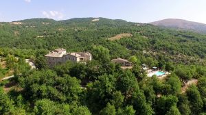 Medieval structure surrounded by trees and green spaces, perfect for a relaxing break.