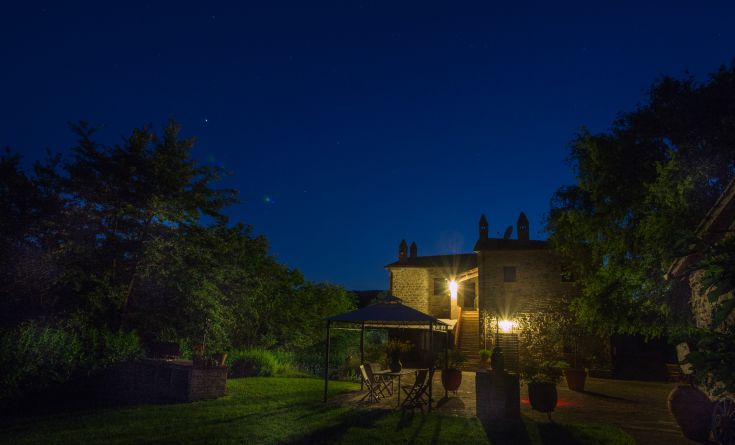 A former convent surrounded by greenery, trees, and meadows, offering a tranquil atmosphere and natural landscapes.