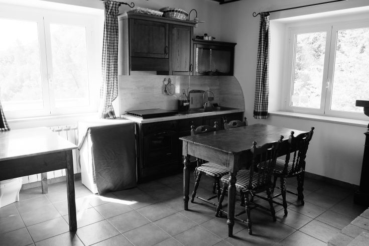 Rustic kitchen with a wooden table and simple, practical details.