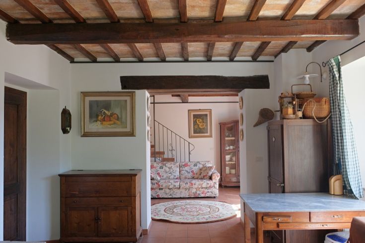 Renovated interior of a building featuring essential and functional furniture in a bright environment.