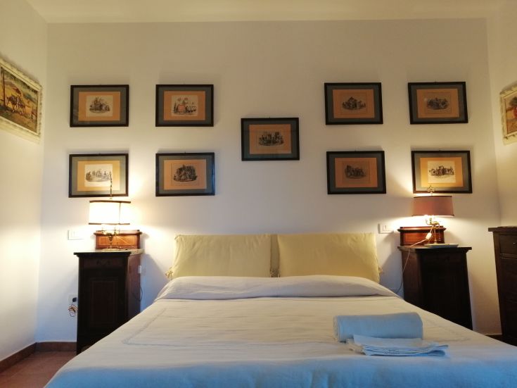 Simple and comfortable room with understated decorations and soft lighting, perfect for relaxation.