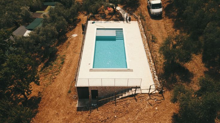 A renovated building with a pool, surrounded by olive trees, in the peaceful Valnerina.