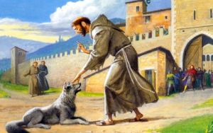 Un disegno a colori ritrae San Francesco che dialoga con un lupo alle porte di una città medievale.