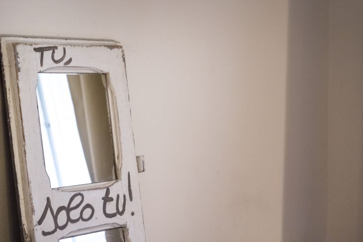 A mirror with a message inviting self-reflection.