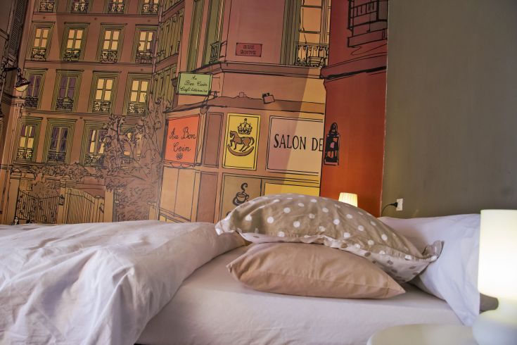 A cozy room with wall decorations that evoke European atmospheres.