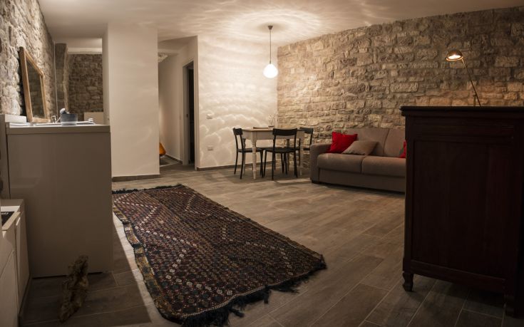 A cozy residence with stone walls, featuring an intimate atmosphere.