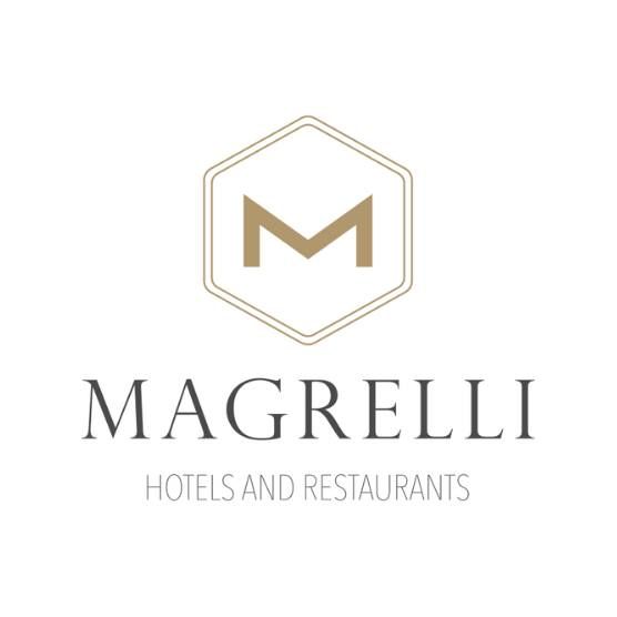 Logo sobrio di Magrelli, rappresentante un servizio di ospitalità di qualità.