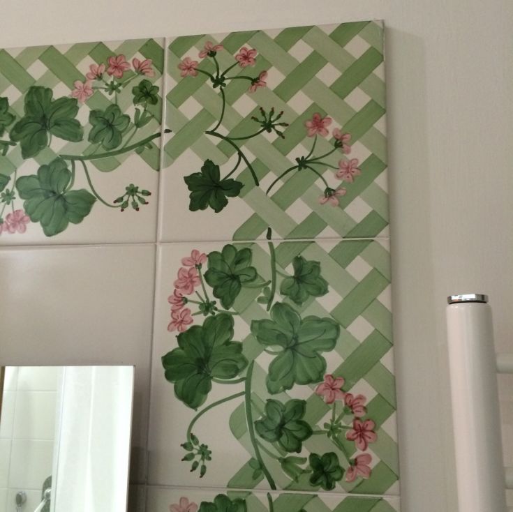 Floral patterns on green tiles create a natural atmosphere in a simple living space.
