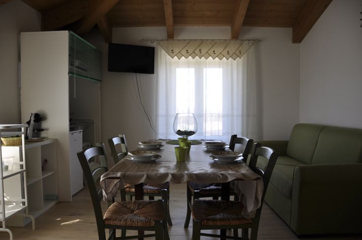 A simple and cozy interior of a farm in Umbria, suitable for families and groups.