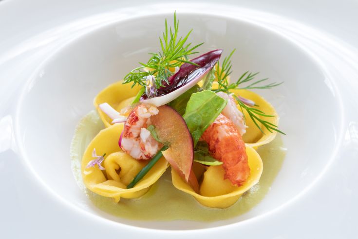 Refined dish of fresh ravioli stuffed with shrimp and seasonal vegetables.