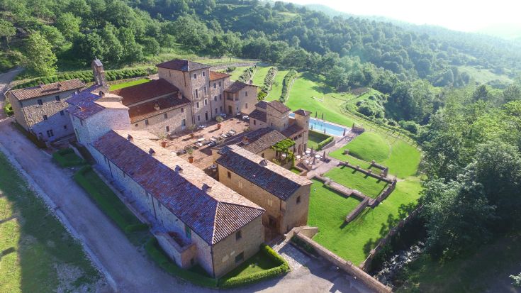 A tranquil place with modern event spaces and pools, set in a medieval village in Umbria.