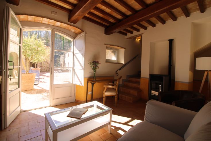 A cozy interior with a view of the surrounding nature, perfect for a relaxing stay.