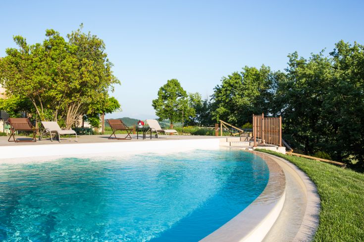 A serene area with a pool surrounded by greenery. An ideal place for relaxation and contemplation.