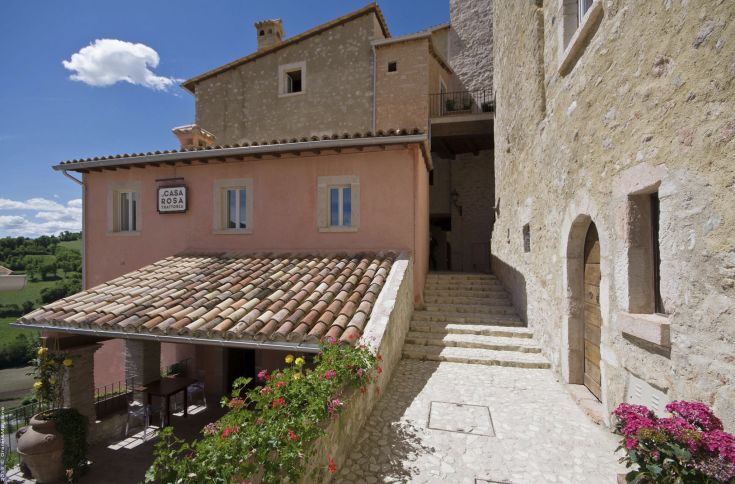 Charming corner of the medieval village with natural scenery and historic architecture.