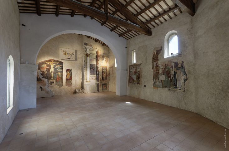 Interior of a historic building in a medieval village, featuring architectural elements and decorations.