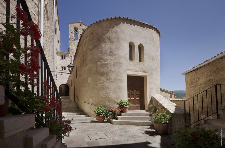 Panoramic view of Postignano Castle, an ancient medieval village in Valnerina with historic architecture.