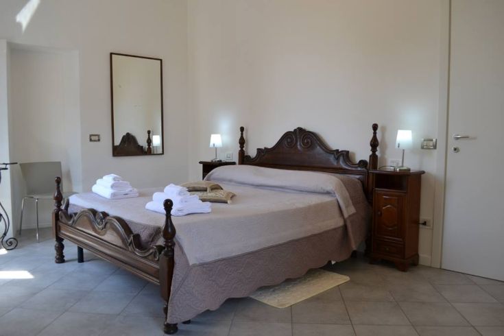 Basic room in a historic building, perfect for a relaxing stay.