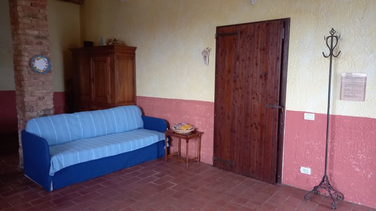 Cozy living room with a blue sofa and coffee table, perfect for moments of relaxation.