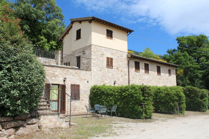 A stone palace surrounded by lush greenery, perfect for a peaceful stay in nature.