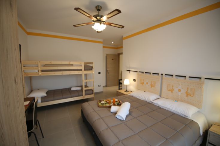 Cozy and simple room in a family-run B&B, perfect for families and tourists.