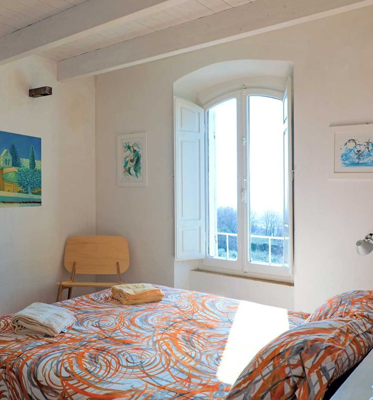 Spacious room with a king-size bed and valley view, perfect for a peaceful stay.